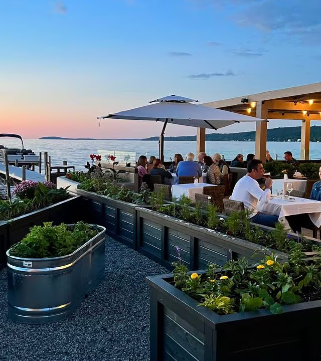 Waterfront patio and garden at Magnoliya Grand